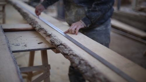 The Carpenter Draws a Line for Cutting Boards