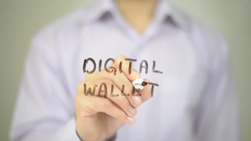 Person Writes Digital Wallet on Transparent Surface