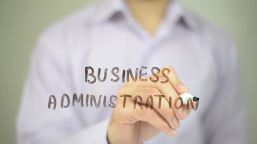 Business Administration Written on Glass Surface by Hand