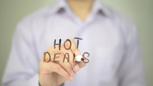 Man Writes Hot Deals on Clear Surface