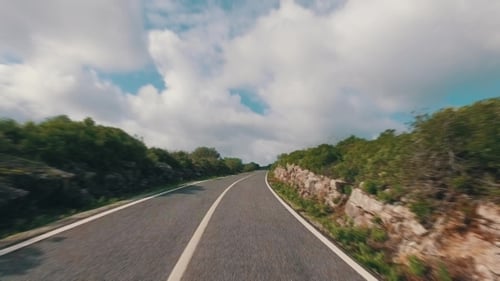 Speedy Driving On a Narrow Road In Mountains