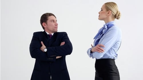 Business Man and Woman Standing Back to Back