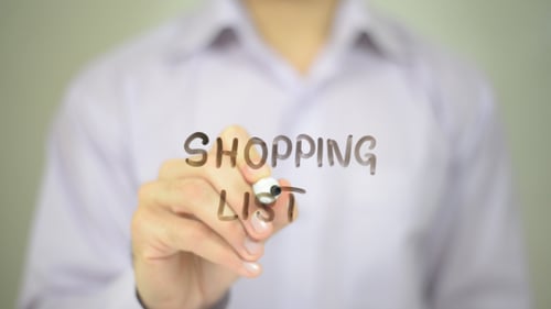 Writing Shopping List on Clear Surface