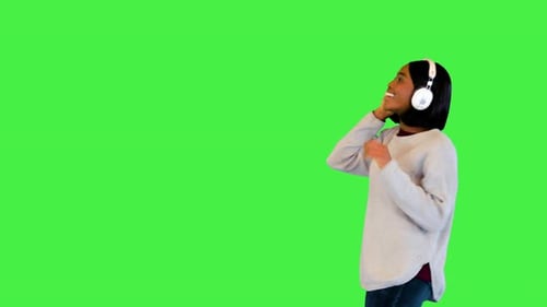 Happy Black Girl Enjoy Favorite Song Listen Joyful Pop Music in Headphones Walk and Dance Chilling