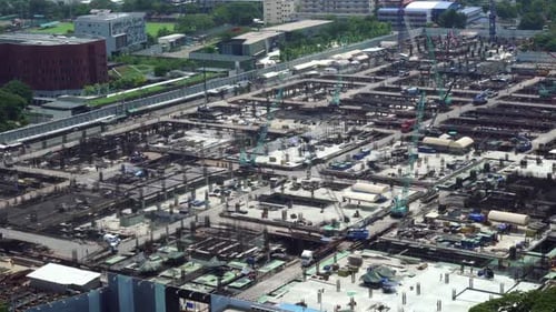 Large Construction Site with Heavy Construction Machinery in Metropolis