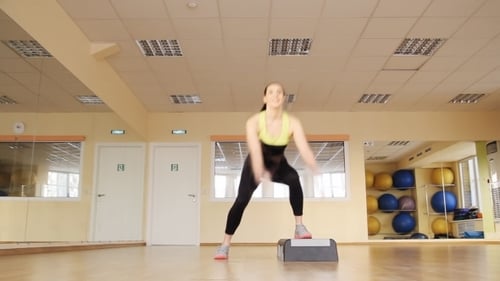 Athletic Woman Trains At The Gym