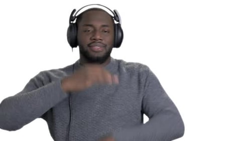 Man Wearing Headphones Listening and Dancing to Music