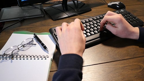 Male Hands Typing On A Keyboard