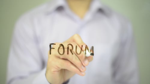 Writing Forum Message on Clear Surface