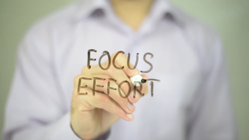 Man Writes Focus Effort on Screen