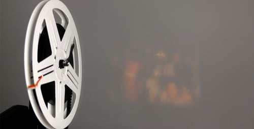 White Film Reel Rotating on Grey Background