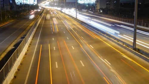 Busy City Highway at Night with Streaking Lights
