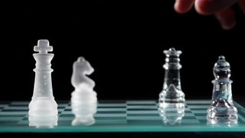 Queen Chess Piece Breaks on Glass Board
