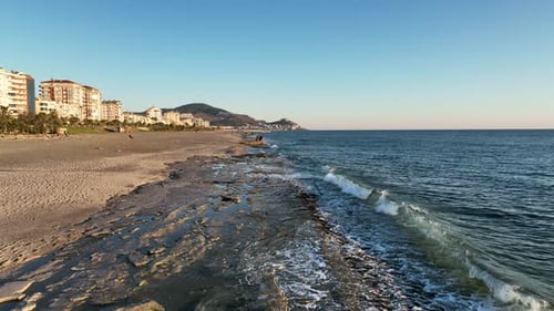 Texture of the rocky beach aerial view 4 K Turkey Alanya