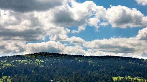 Clouds Over The Forest And Mountain