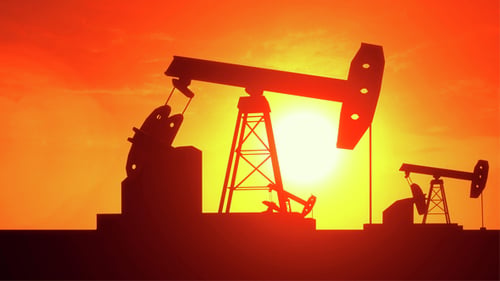 Industrial Oil Pumpjacks Silhouette Pumping Against Sunset
