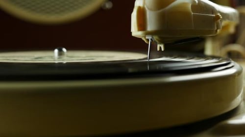 Vintage Record Player Needle on Rotating Vinyl Disc