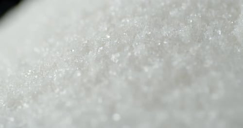 White Sugar Sand Pours Into a Big Pile
