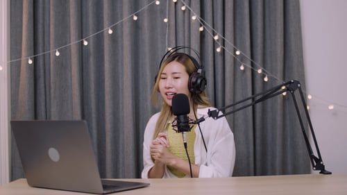 Woman Recording Podcast in Home Studio