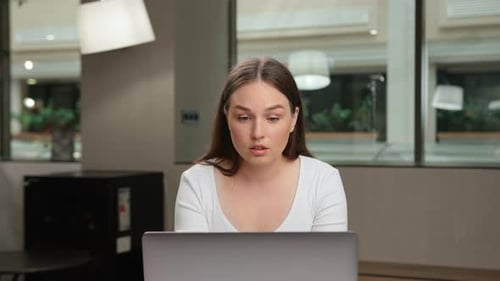 Female office worker chatting on zoom with work colleagues or clients