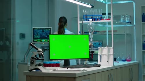 Computer with Green Screen Working in Labooratory with Mock Up Monitor