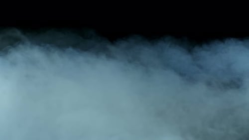 White Smoke Billowing Against Black Background