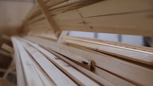 Stacked Lumber Inside Warehouse or Manufacturing Facility