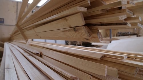 Wooden Planks Stacked in a Storage Building