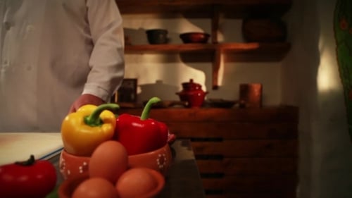 Chef In Restaurant Take Meat Under Big Knife