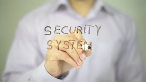 Security System Writing on Transparent Surface Close Up