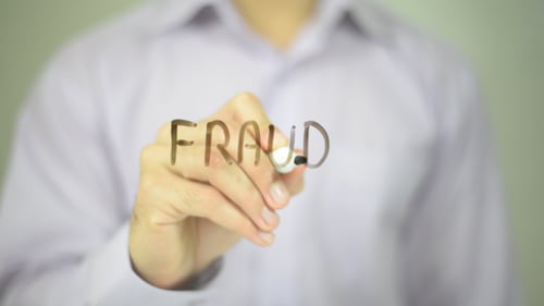 Hand Writing Fraud with Black Marker