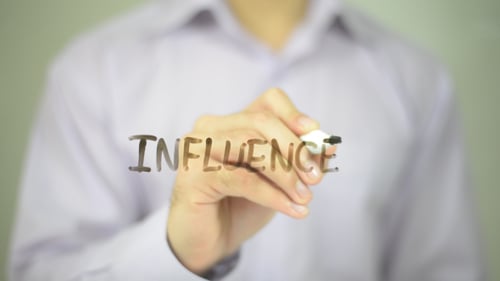 Writing the Word Influence with a Marker