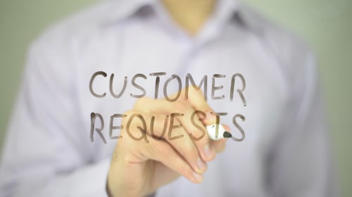 Writing Customer Requests on Clear Surface