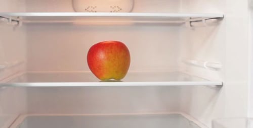 Lonely Apple in Empty Refrigerator Mid Shot