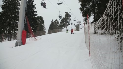 Skiers Enjoying a Day on the Snowy Slopes