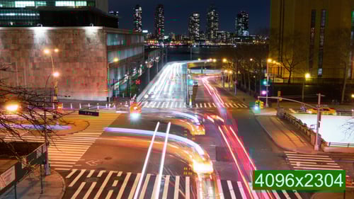 Vibrant Urban Intersection at Night, Time-Lapse Traffic