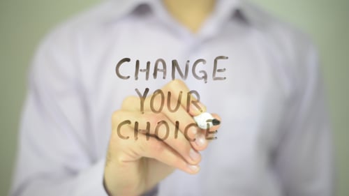 Adult Writing Change Your Choice on Transparent Surface