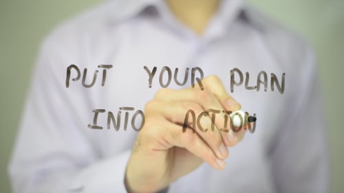 Hand Writes Phrase On A Transparent Surface