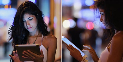 Woman Using Tablet At Night