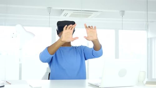 Man wearing virtual reality glasses in Office