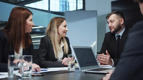 Business People Communicating at Meeting in Office