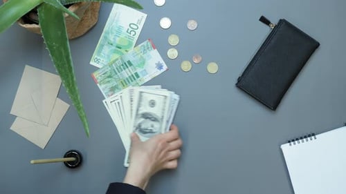 American one hundred dollar paper money pile on office desk