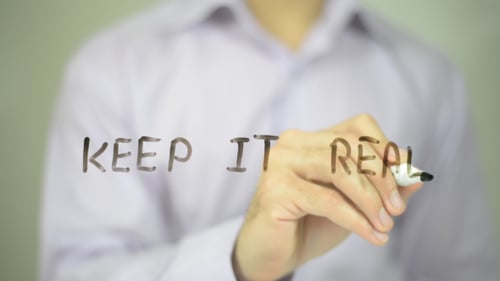 Writing Keep It Real on Transparent Surface