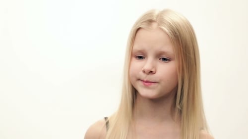Young Girl Looking Upward and Scratching Head