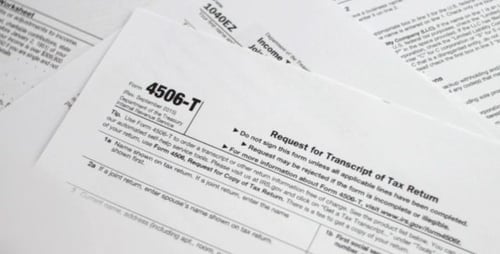 Various IRS Tax Forms On White Surface