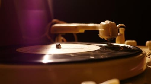 Vintage Record Player Spins in Dim Lighting