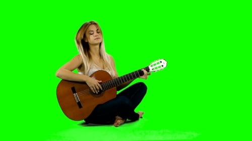 Young Woman Plays Guitar on Green Screen