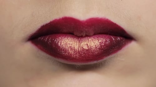 Close Up of Lips with Red and Gold Lipstick