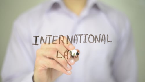 Hand Writing International Law with Marker