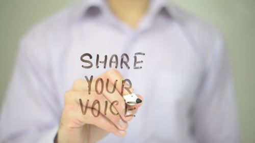 Writing 'Share Your Voice' on Clear Surface